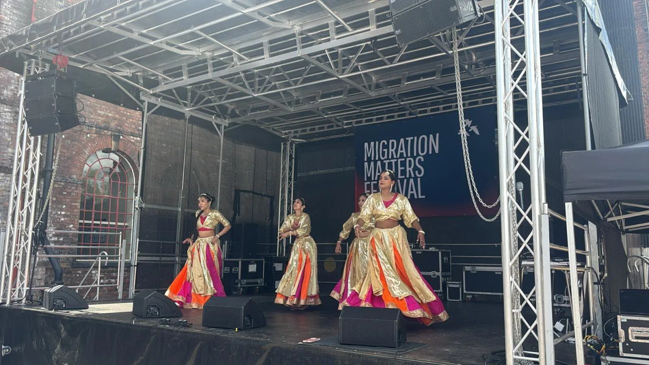 Dance group performing on a covered 7x6m festival stage