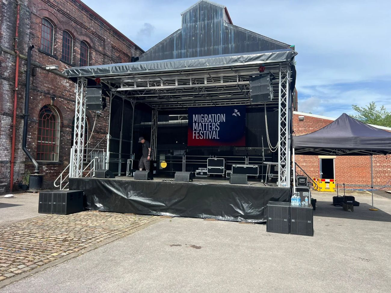 7x6m mobile stage with line-array PA flown at both sides